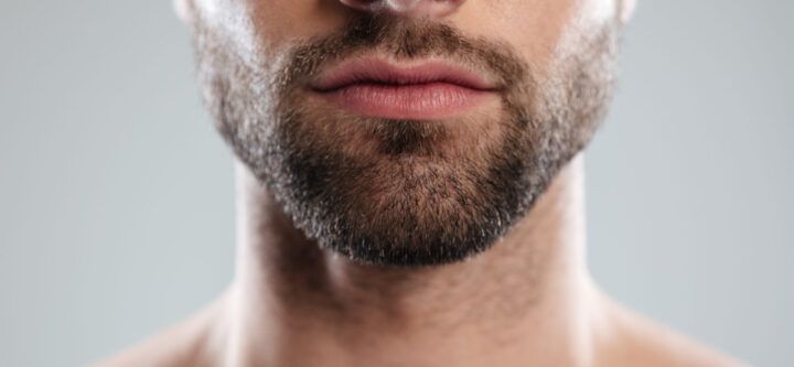Cropped image of a half mans face with beard