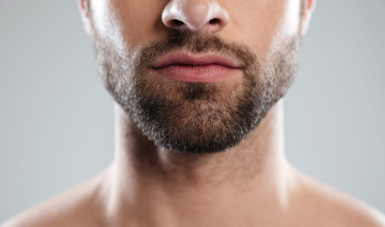 Cropped image of a half mans face with beard